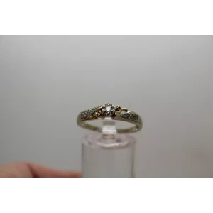 10k W.G. .11ctw DIAMOND SOLITAIRE w/ accents Ring size 9.75