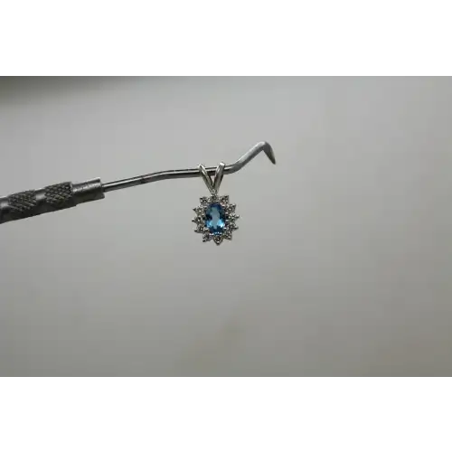 14k W.G. Oval Cut BLUE TOPAZ & WHITE SAPPHIRE HALO pendant