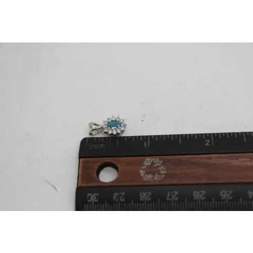 14k W.G. Oval Cut BLUE TOPAZ & WHITE SAPPHIRE HALO pendant