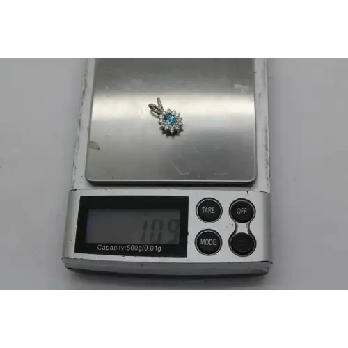 14k W.G. Oval Cut BLUE TOPAZ & WHITE SAPPHIRE HALO pendant
