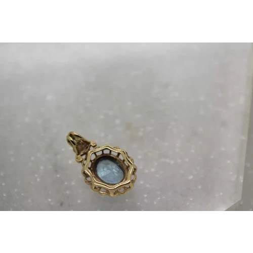 14k Y.G. Oval Cut BLUE TOPAZ FILIGREE pendant