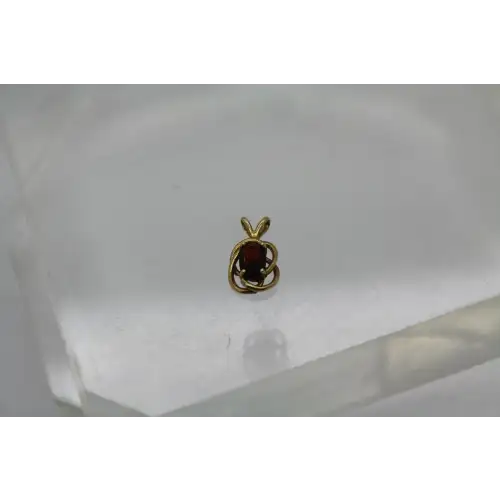 14k Y.G. Oval Cut GARNET KNOT DESIGN pendant #