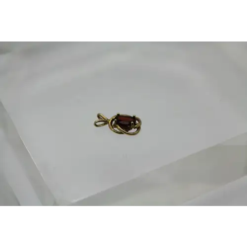 14k Y.G. Oval Cut GARNET KNOT DESIGN pendant #