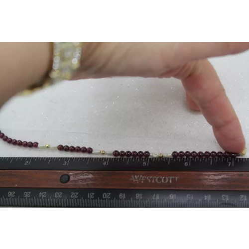 14k Y.G. PURPLE GEMSTONE & FRESHWATER RICE PEARL BRACELET 7