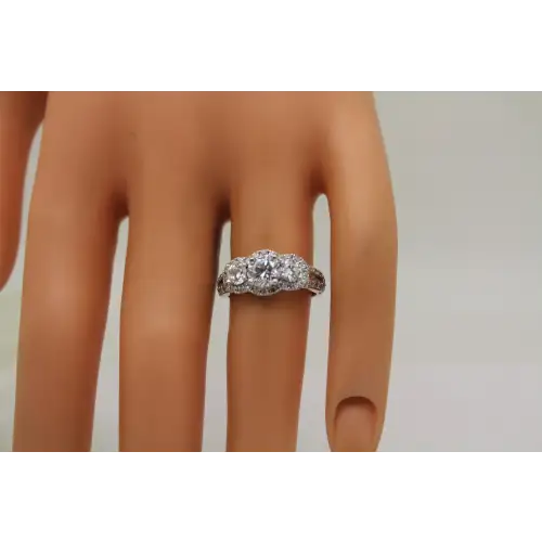 FAS .925 S.S. CLEAR CZ 3 STONE HALO w/ accents ring size 6
