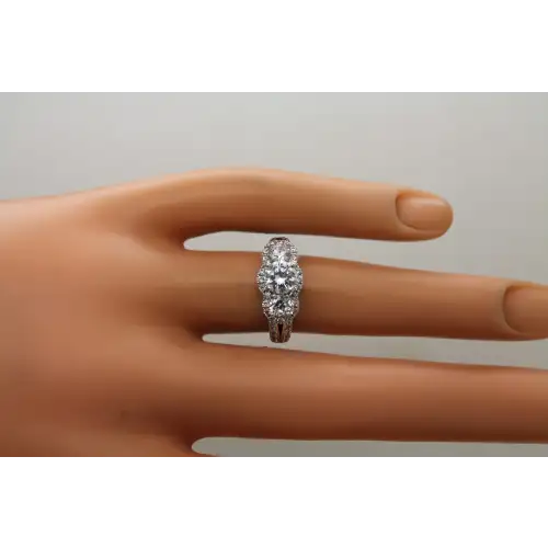 FAS .925 S.S. CLEAR CZ 3 STONE HALO w/ accents ring size 6