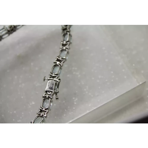 HENG NGAI .925 S.S. Oval Cut BLUE TOPAZ TENNIS bracelet 7 1/4