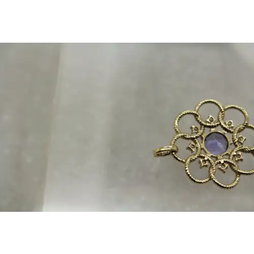 KALATI 14k Y.G. TANZANITE & DIAMOND OPENWORK FLOWER pend.