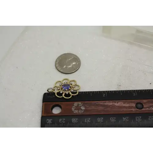 KALATI 14k Y.G. TANZANITE & DIAMOND OPENWORK FLOWER pend.