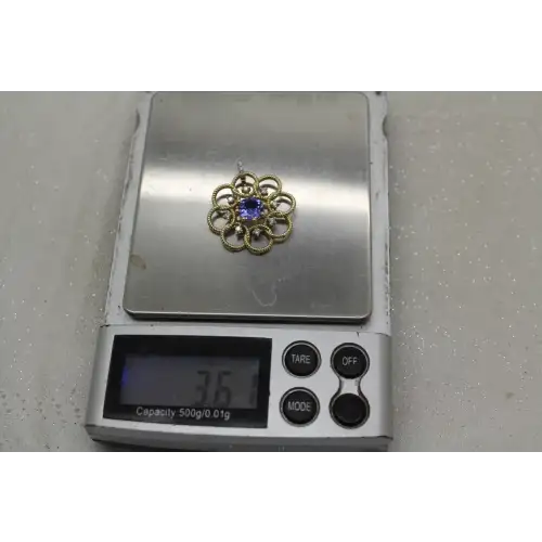 KALATI 14k Y.G. TANZANITE & DIAMOND OPENWORK FLOWER pend.