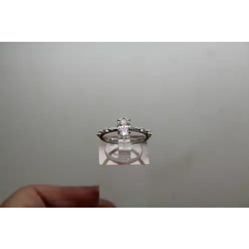NWOT .925 S.S. Oval Cut MOISSANITE SOLITAIRE w/acc. ring size 6