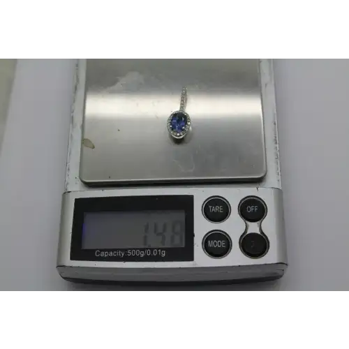 Signed 10k W.G. BLUE SAPPHIRE & .25ctw DIAMOND HALO pendant #