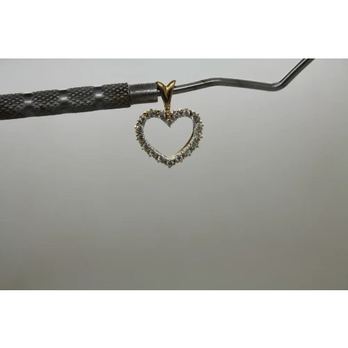 Signed 10k Y.G. .18ctw DIAMOND OPEN HEART DESIGN pendant