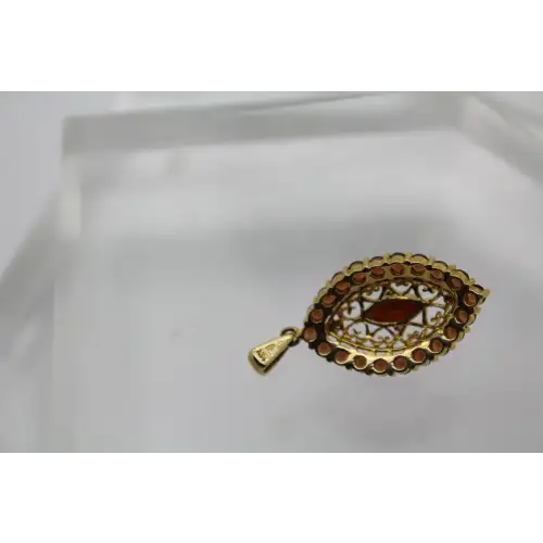 Signed 14k Y.G. GARNET FILIGREE HALO pendant #