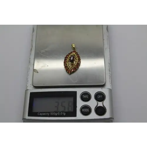 Signed 14k Y.G. GARNET FILIGREE HALO pendant #