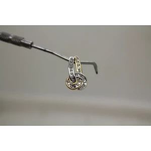 Signed 14k Y.G. & W.G. .24ctw DIAMOND KNOT DESIGN pendant