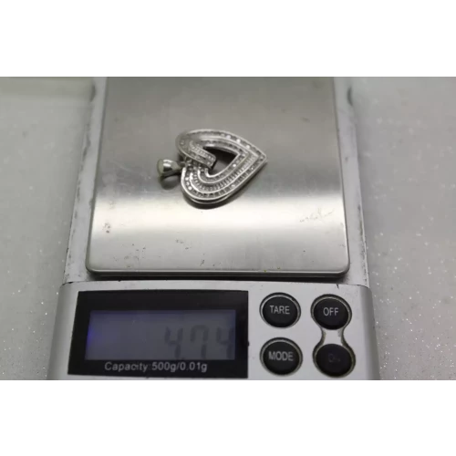 Signed .925 S.S. 1.00ctw DOUBLE ROW DIAMOND SWIRL HEART pendant