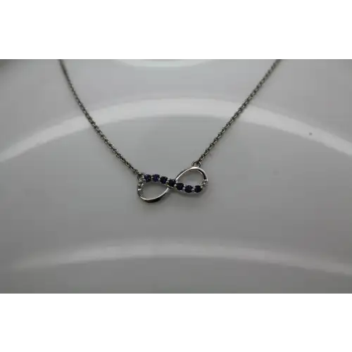 Signed .925 S.S. BLUE TOPAZ & DIAMOND acc. INFINITY necklace