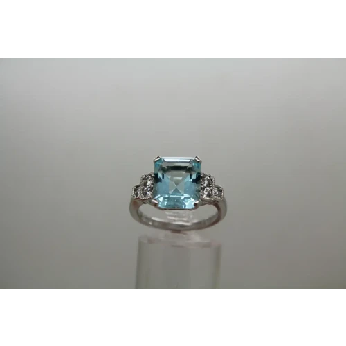 Signed .925 S.S. Emerald Cut LARGE BLUE CZ with accents ring size 8