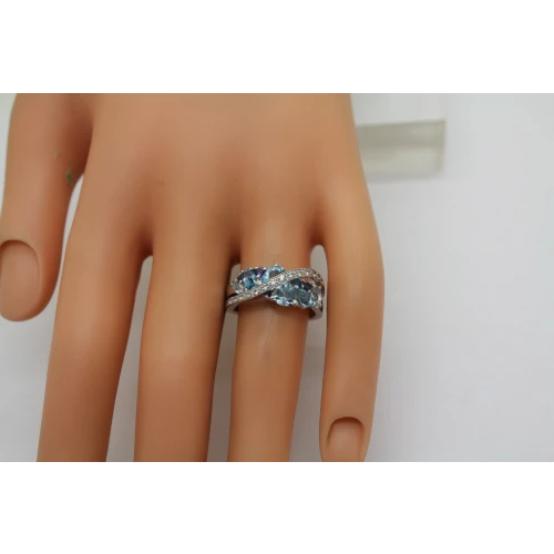 Signed .925 S.S. Shades of Blue BLUE TOPAZ CROSSOVER ring size. 6.75 #