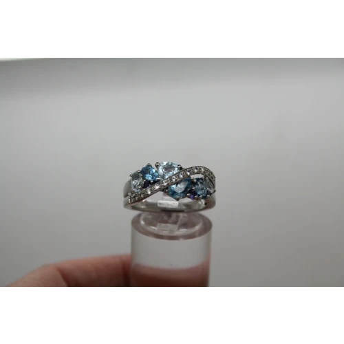 Signed .925 S.S. Shades of Blue BLUE TOPAZ CROSSOVER ring size. 6.75 #