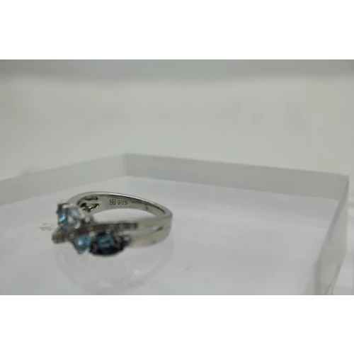 Signed .925 S.S. Shades of Blue BLUE TOPAZ CROSSOVER ring size. 6.75 #