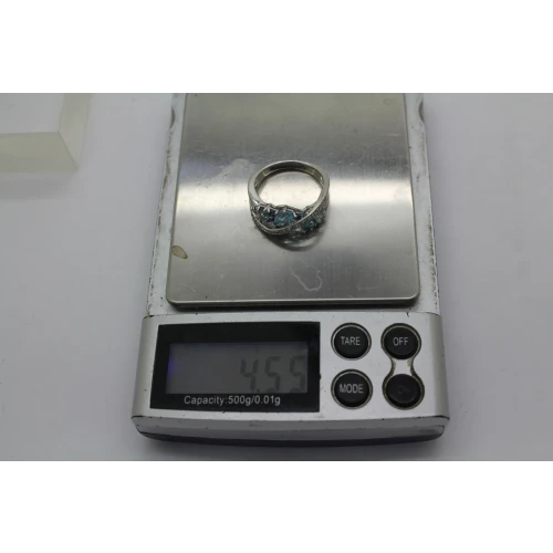 Signed .925 S.S. Shades of Blue BLUE TOPAZ CROSSOVER ring size. 6.75 #