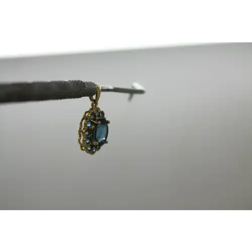 Signed DDB 10k Y.G. LONDON BLUE TOPAZ HALO pendant