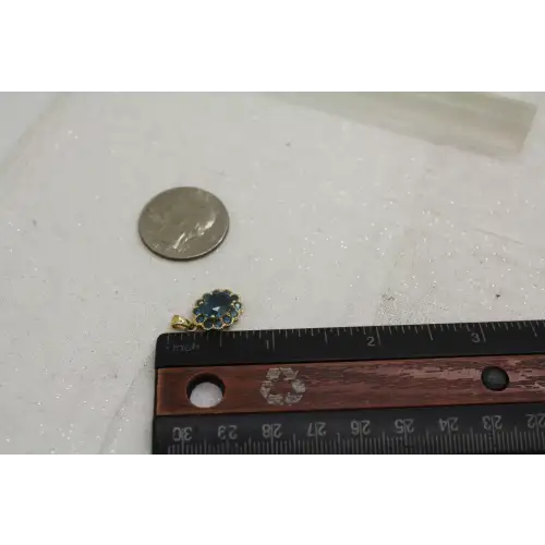 Signed DDB 10k Y.G. LONDON BLUE TOPAZ HALO pendant