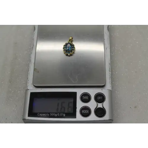 Signed DDB 10k Y.G. LONDON BLUE TOPAZ HALO pendant