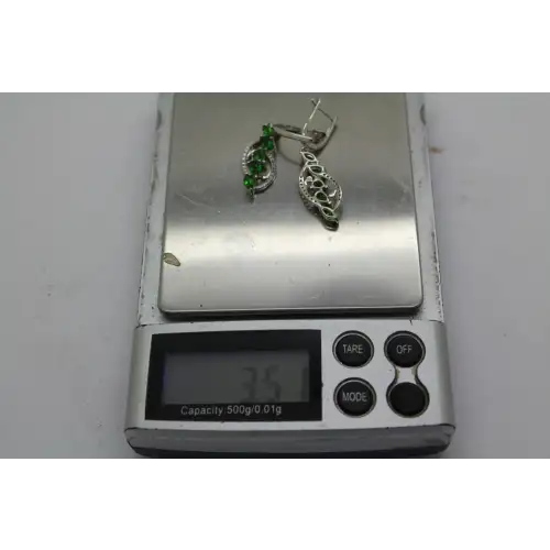 Signed DK .925 S.S. PERIDOT & DIAMOND SWIRL DESIGN dangle earrings # (5)