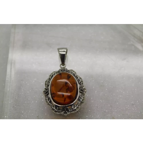 Signed NF. 925 S.S. BALTIC AMBER FLORAL DESIGN OVAL pendant