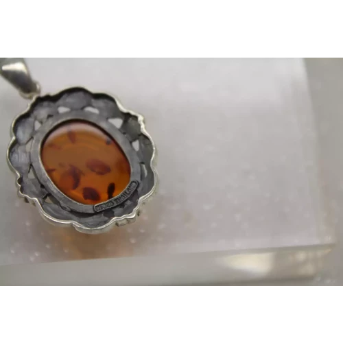 Signed NF. 925 S.S. BALTIC AMBER FLORAL DESIGN OVAL pendant