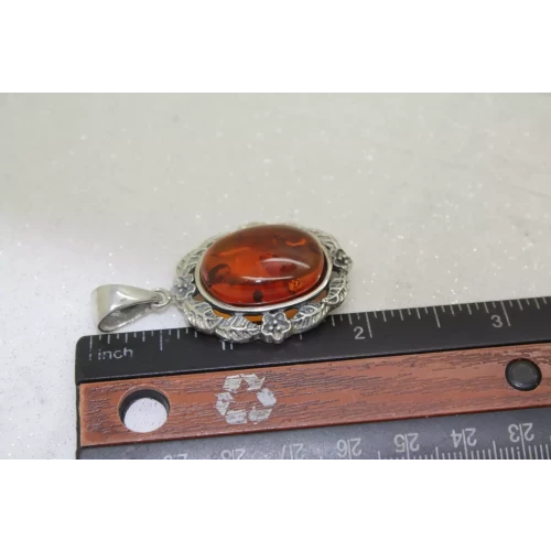 Signed NF. 925 S.S. BALTIC AMBER FLORAL DESIGN OVAL pendant