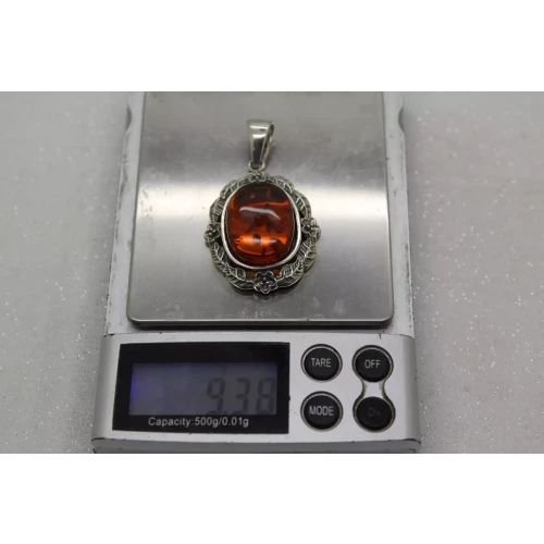Signed NF. 925 S.S. BALTIC AMBER FLORAL DESIGN OVAL pendant