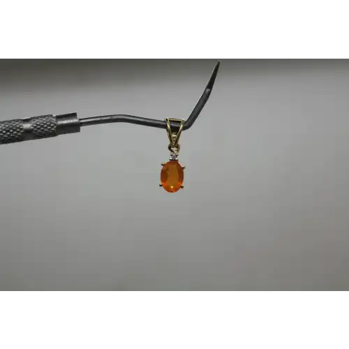 Signed STS 14k Y.G. ORANGE STONE w/ accent DIAMOND OVAL pendant
