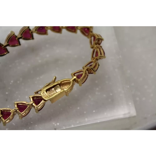 Signed UTC gold over .925 S.S. TRILLION CUT PINK SAPPHIRE bracelet 8