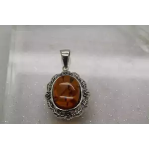 Signed NF. 925 S.S. BALTIC AMBER FLORAL DESIGN OVAL pendant