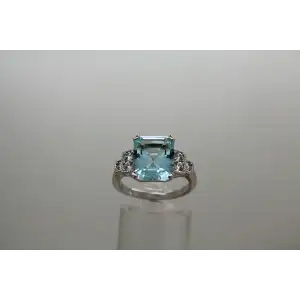 Signed .925 S.S. Emerald Cut LARGE BLUE CZ with accents ring size 8