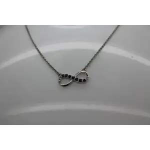 Signed .925 S.S. BLUE TOPAZ & DIAMOND acc. INFINITY necklace
