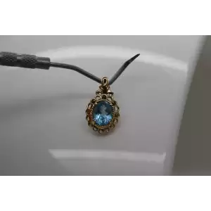 14k Y.G. Oval Cut BLUE TOPAZ FILIGREE pendant