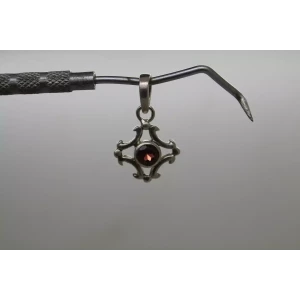 Vtg. .925 S.S. GARNET OPEN WORK CROSS DESIGN pendant